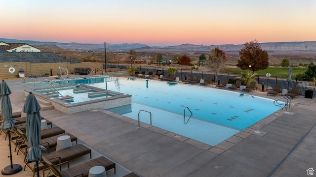 0, Washington, UT 84780 - pool at dusk with a pool with connected hot tub, a patio, and a mountain view