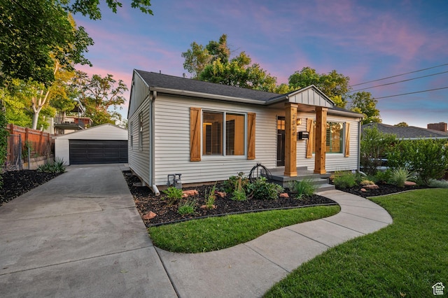 2524 E Redondo Ave, Salt Lake City, UT 84108 - bungalow-style home featuring a detached garage, an outdoor structure, covered porch, and board and batten siding
