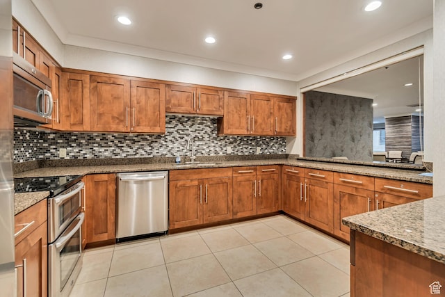 48 W 300 S Unit 1803N, Salt Lake City, UT 84101 - kitchen with stainless steel appliances, a sink, brown cabinets, dark stone counters, and recessed lighting