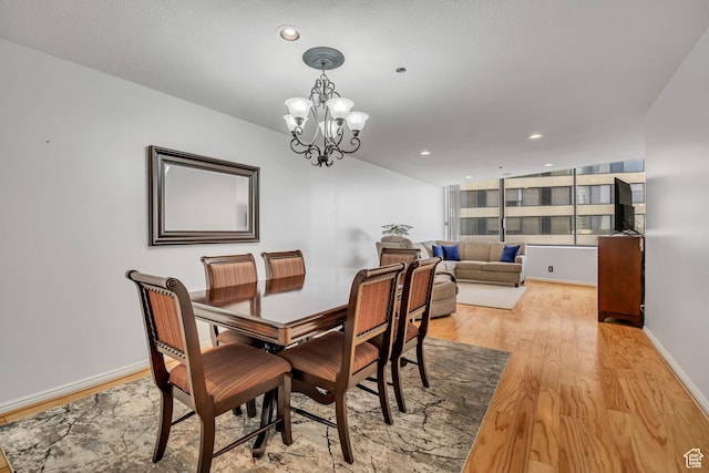 48 W 300 S Unit 1803N, Salt Lake City, UT 84101 - dining area featuring light wood finished floors, a chandelier, baseboards, and recessed lighting