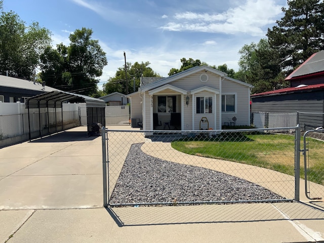 955 N Catherine St, Salt Lake City, UT 84116 - view of front facade featuring a detached carport, a gate, and driveway