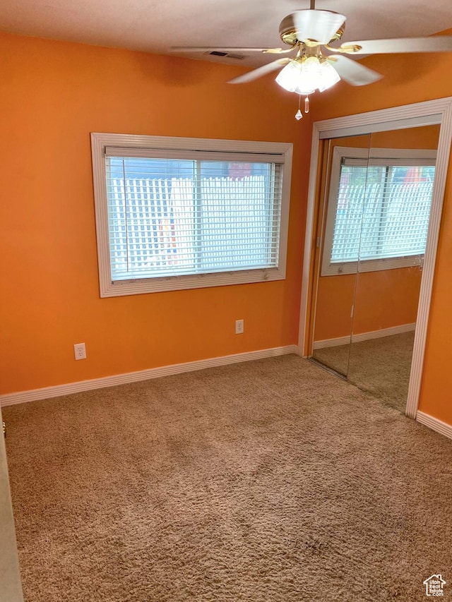 955 N Catherine St, Salt Lake City, UT 84116 - carpeted spare room featuring healthy amount of natural light, a ceiling fan, and baseboards