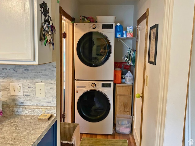 955 N Catherine St, Salt Lake City, UT 84116 - laundry area with stacked washer / drying machine and wood finished floors