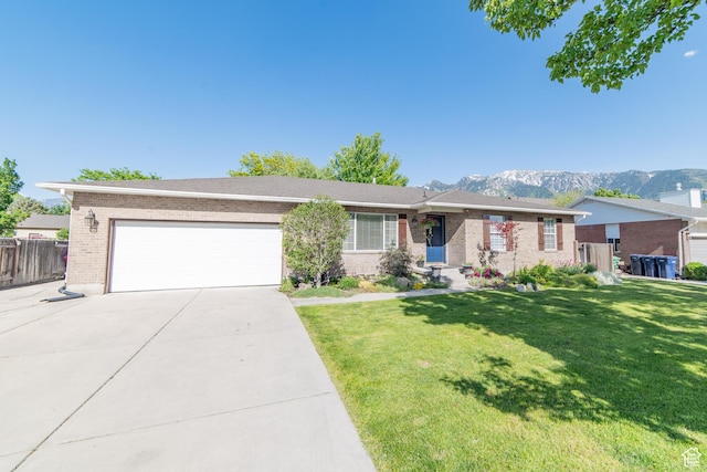 10273 S Flanders Rd, Sandy, UT 84092 - ranch-style home featuring brick siding, an attached garage, driveway, and a mountain view