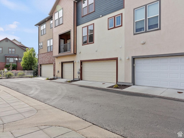 335 E Park Blvd S, Ogden, UT 84401 - view of front of home featuring an attached garage and stucco siding