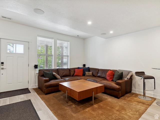 335 E Park Blvd S, Ogden, UT 84401 - living area featuring plenty of natural light, light wood-style flooring, recessed lighting, baseboards, and a textured ceiling