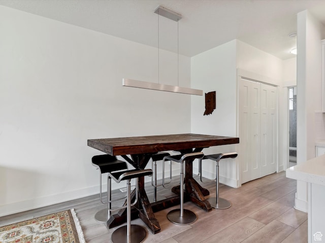 335 E Park Blvd S, Ogden, UT 84401 - dining room featuring light wood-style floors and baseboards