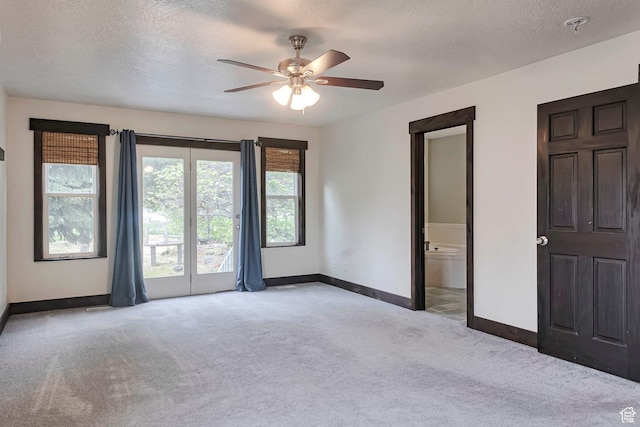 2101 W 325 S, Mapleton, UT 84664 - unfurnished bedroom with light colored carpet, a textured ceiling, ceiling fan, and access to exterior