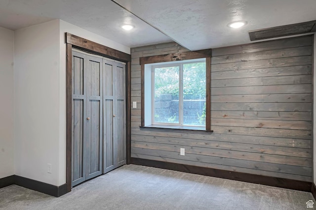 2101 W 325 S, Mapleton, UT 84664 - unfurnished bedroom with light carpet, wood walls, recessed lighting, and a closet