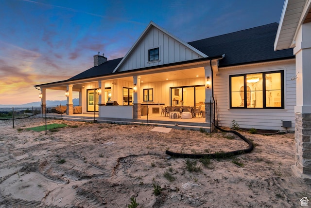 1366 S 370 E, Salem, UT 84653 - back of house at dusk with board and batten siding and a chimney