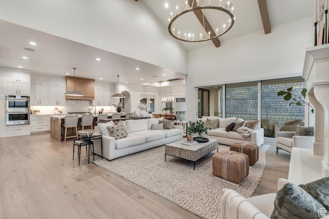1366 S 370 E, Salem, UT 84653 - living room featuring a chandelier, light wood-style flooring, a high ceiling, beam ceiling, and recessed lighting