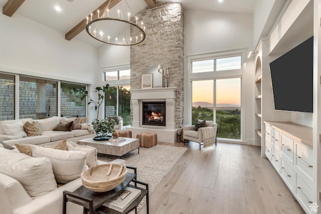 1366 S 370 E, Salem, UT 84653 - living room with high vaulted ceiling, beamed ceiling, a chandelier, light wood-style floors, and plenty of natural light