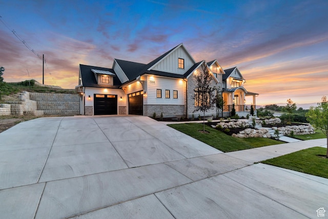 1366 S 370 E, Salem, UT 84653 - view of front of home with stone siding, a garage, concrete driveway, board and batten siding, and a lawn