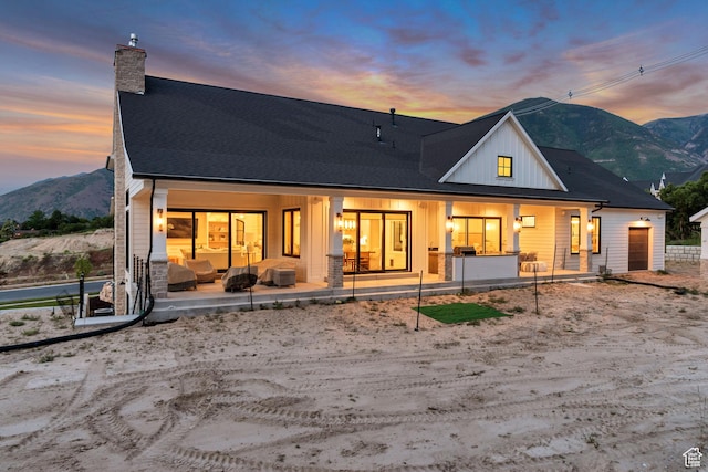 1366 S 370 E, Salem, UT 84653 - back of property featuring a chimney, a mountain view, a porch, and an attached garage