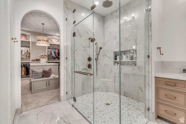 1366 S 370 E, Salem, UT 84653 - bathroom with marble look tiles, a marble finish shower, a spacious closet, and vanity