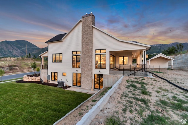 1366 S 370 E, Salem, UT 84653 - back of property at dusk with central AC, a mountain view, and a chimney