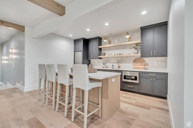 1366 S 370 E, Salem, UT 84653 - kitchen featuring stainless steel oven, open shelves, tasteful backsplash, light wood-type flooring, and beamed ceiling