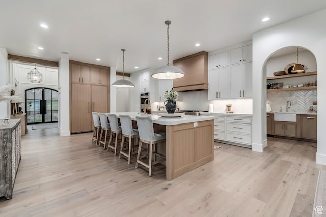 1366 S 370 E, Salem, UT 84653 - kitchen with a sink, tasteful backsplash, recessed lighting, light countertops, and a kitchen island with sink