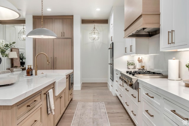 1366 S 370 E, Salem, UT 84653 - kitchen with premium range hood, appliances with stainless steel finishes, a sink, baseboards, and light wood finished floors