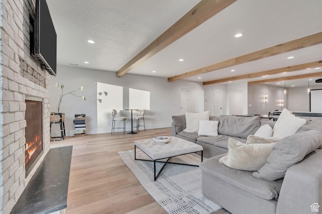 1366 S 370 E, Salem, UT 84653 - living room with a large fireplace, beamed ceiling, recessed lighting, light wood-style flooring, and baseboards