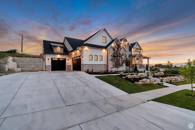 1366 S 370 E, Salem, UT 84653 - modern farmhouse style home featuring board and batten siding, stone siding, a standing seam roof, driveway, and a front yard