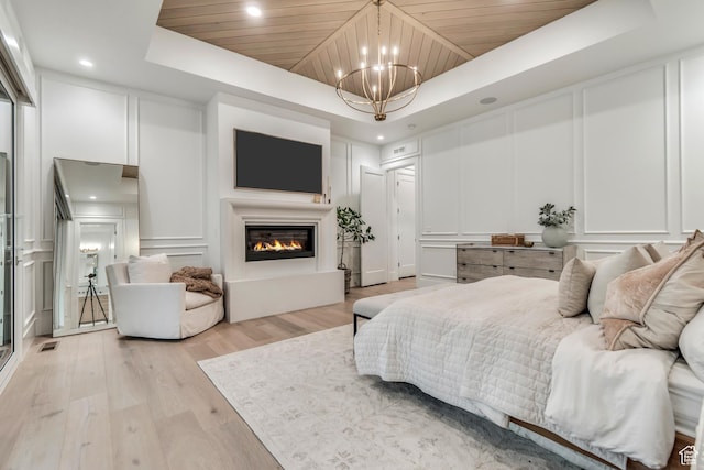 1366 S 370 E, Salem, UT 84653 - bedroom featuring a decorative wall, a tray ceiling, a chandelier, light wood-type flooring, and wooden ceiling