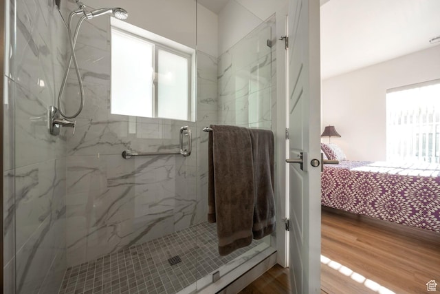 3610 S 805 E Unit 233, Millcreek, UT 84106 - ensuite bathroom with a marble finish shower and wood finished floors