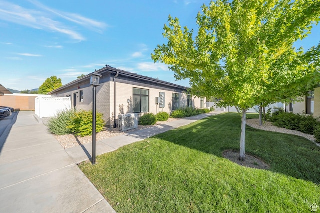 3610 S 805 E Unit 233, Millcreek, UT 84106 - view of property exterior with brick siding and central AC unit