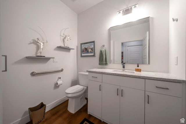 3610 S 805 E Unit 233, Millcreek, UT 84106 - bathroom with vanity, toilet, wood finished floors, and baseboards