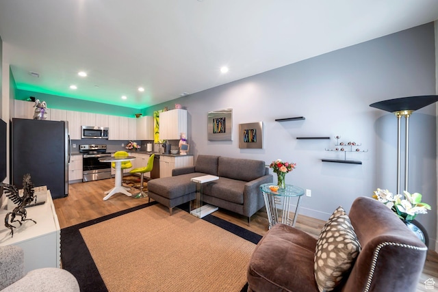 3610 S 805 E Unit 233, Millcreek, UT 84106 - living room featuring light wood finished floors, recessed lighting, and baseboards