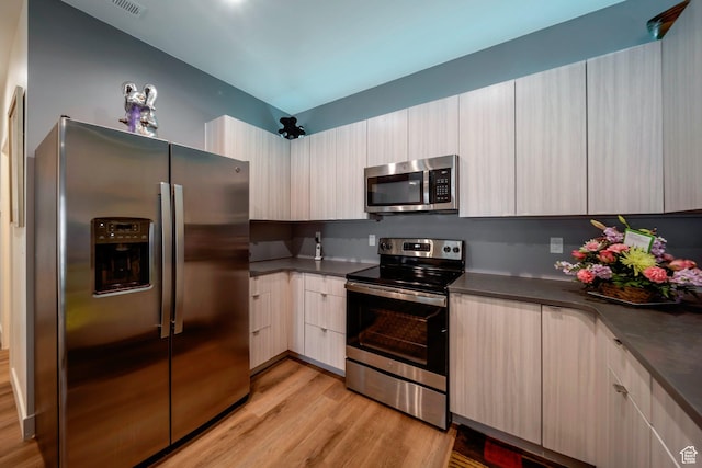 3610 S 805 E Unit 233, Millcreek, UT 84106 - kitchen with appliances with stainless steel finishes, light wood-type flooring, dark countertops, and modern cabinets