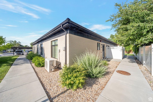 3610 S 805 E Unit 233, Millcreek, UT 84106 - view of side of home featuring brick siding and ac unit