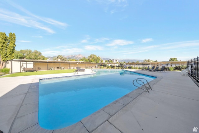 3610 S 805 E Unit 233, Millcreek, UT 84106 - view of pool featuring a mountain view and a patio