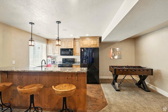674 S 150 W, Hyde Park, UT 84318 - kitchen featuring black appliances, a sink, light stone counters, baseboards, and a textured ceiling