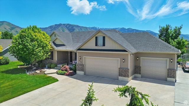 674 S 150 W, Hyde Park, UT 84318 - craftsman inspired home featuring concrete driveway, a mountain view, an attached garage, and brick siding