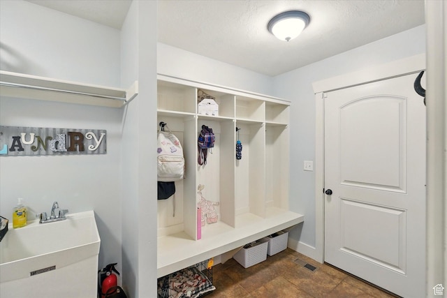 674 S 150 W, Hyde Park, UT 84318 - mudroom featuring a sink and baseboards