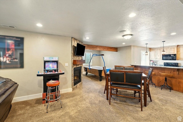 674 S 150 W, Hyde Park, UT 84318 - dining area featuring light colored carpet, recessed lighting, a stone fireplace, baseboards, and a textured ceiling