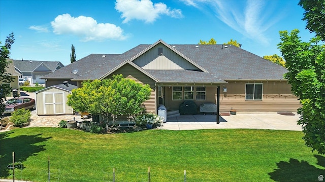 674 S 150 W, Hyde Park, UT 84318 - back of house featuring a patio, board and batten siding, a lawn, and a shingled roof