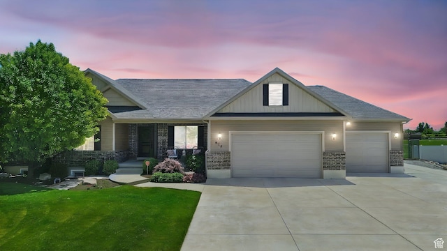 674 S 150 W, Hyde Park, UT 84318 - view of front of house featuring an attached garage, driveway, and a front lawn