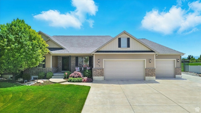 674 S 150 W, Hyde Park, UT 84318 - craftsman house with a garage, brick siding, driveway, a front yard, and a shingled roof