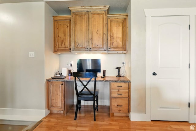 674 S 150 W, Hyde Park, UT 84318 - office with light wood-style floors, built in desk, and baseboards