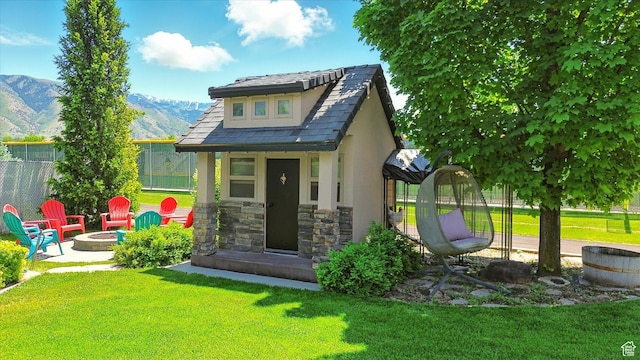 674 S 150 W, Hyde Park, UT 84318 - view of outbuilding with an outdoor fire pit and a mountain view