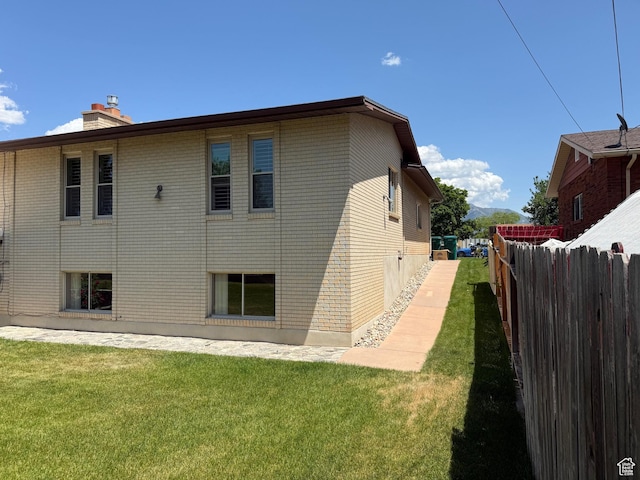 5253 S 2150 W, Roy, UT 84067 - rear view of property featuring a chimney