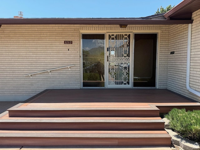 5253 S 2150 W, Roy, UT 84067 - property entrance featuring brick siding and a deck