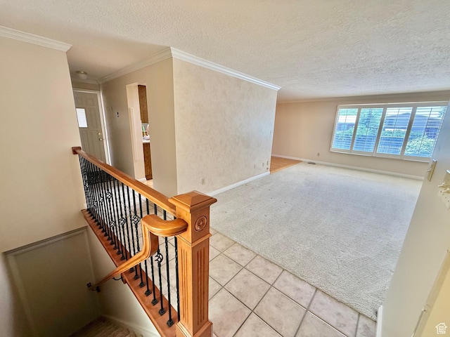 5253 S 2150 W, Roy, UT 84067 - stairs featuring carpet floors, a textured ceiling, ornamental molding, tile patterned flooring, and baseboards