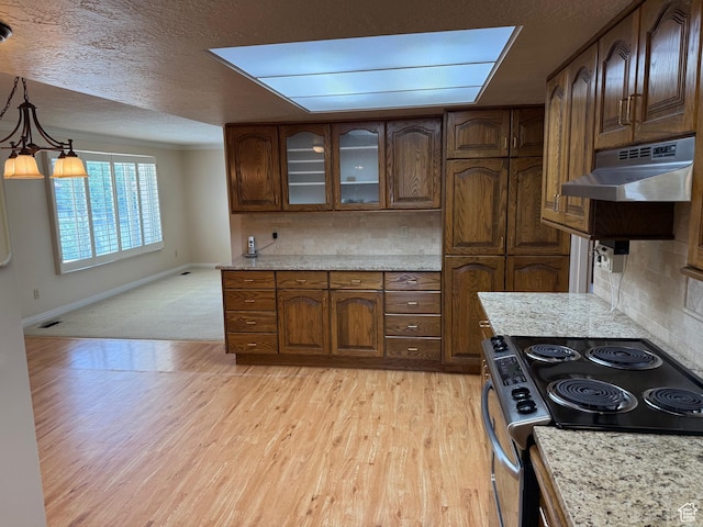 5253 S 2150 W, Roy, UT 84067 - kitchen featuring electric stove, under cabinet range hood, baseboards, light wood-type flooring, and decorative backsplash