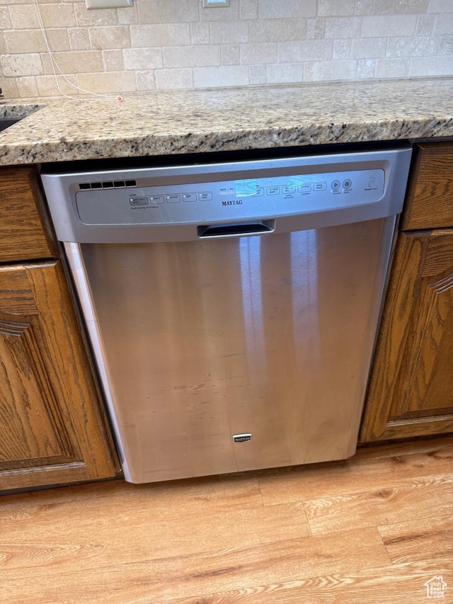 5253 S 2150 W, Roy, UT 84067 - kitchen view of dishwasher, brown cabinetry, and decorative backsplash