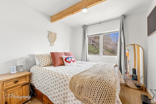 332 W Pinehurst Dr, Brian Head, UT 84719 - bedroom featuring light wood-style flooring and beam ceiling