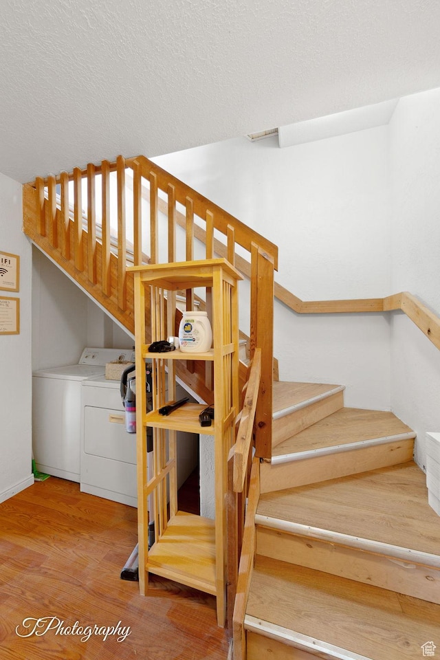 332 W Pinehurst Dr, Brian Head, UT 84719 - stairway with washing machine and dryer, wood finished floors, a textured ceiling, and baseboards