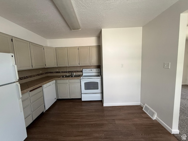 2168 S Harrison Blvd, Ogden, UT 84401 - kitchen with white appliances, dark wood-type flooring, a sink, tile countertops, and a textured ceiling